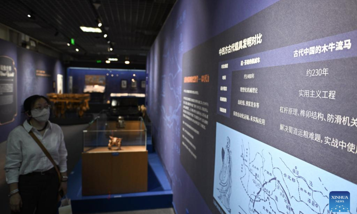 A visitor views a display board during the exhibition Harmony through Time and Space: How Leonardo da Vinci Created Concord between His Artistic and Scientific World and the Natural World at the Natural History Museum of China in Beijing, capital of China, June 5, 2025. The exhibition kicked off here on Thursday and will last until October 19. (Xinhua/Chen Zhonghao)