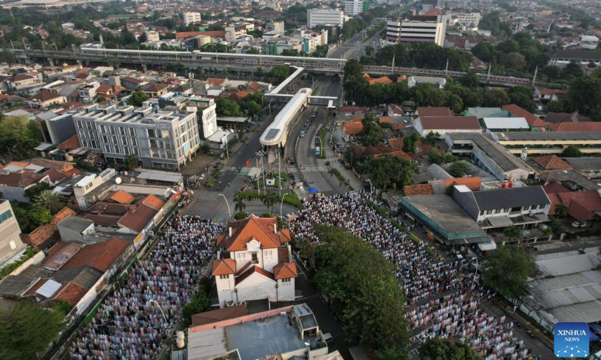 An aerial drone photo shows people performing Eid al-Adha prayer at Jatinegara in Jakarta, Indonesia on June 6, 2025. (Xinhua/Veri Sanovri)