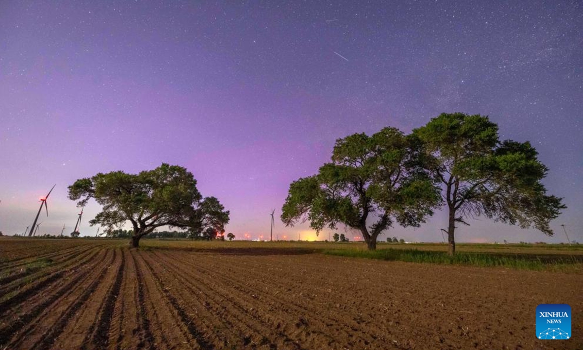 This photo taken on June 1, 2025 shows a view of aurora in Qiqihar City, northeast China's Heilongjiang Province. (Photo by Wang Yonggang/Xinhua)