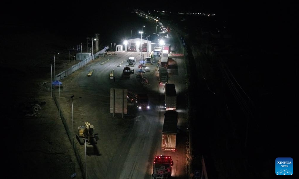 Vehicles are under inspection at Irkeshtam port in Wuqia County, Kirgiz Autonomous Prefecture of Kizilsu in northwest China's Xinjiang Uygur Autonomous Region, June 2, 2025. The Irkeshtam port in northwest China's Xinjiang Uygur Autonomous Region launched a trial of 24-hour freight clearance operations on Sunday, making it the second land port in the region and the first in southern Xinjiang to adopt such a system. This move is aimed at enhancing trade logistics between China and Central Asia, according to the local immigration inspection station. (Photo by Fei Qiang/Xinhua)