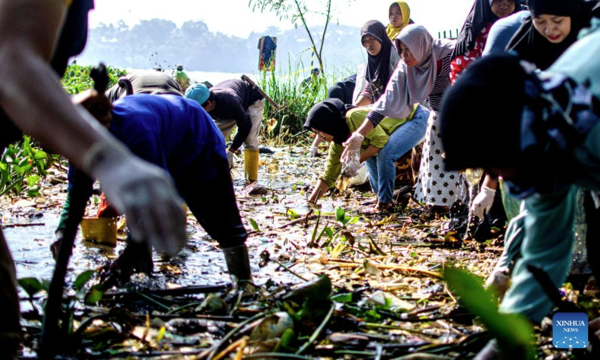 People sort and collect plastic garbage as a part of a campaign marking the upcoming World Environment Day, observed annually on June 5, on Citarum River in West Bandung Regency, West Java, Indonesia, June 4, 2025. (Photo by Septianjar Muharam/Xinhua)