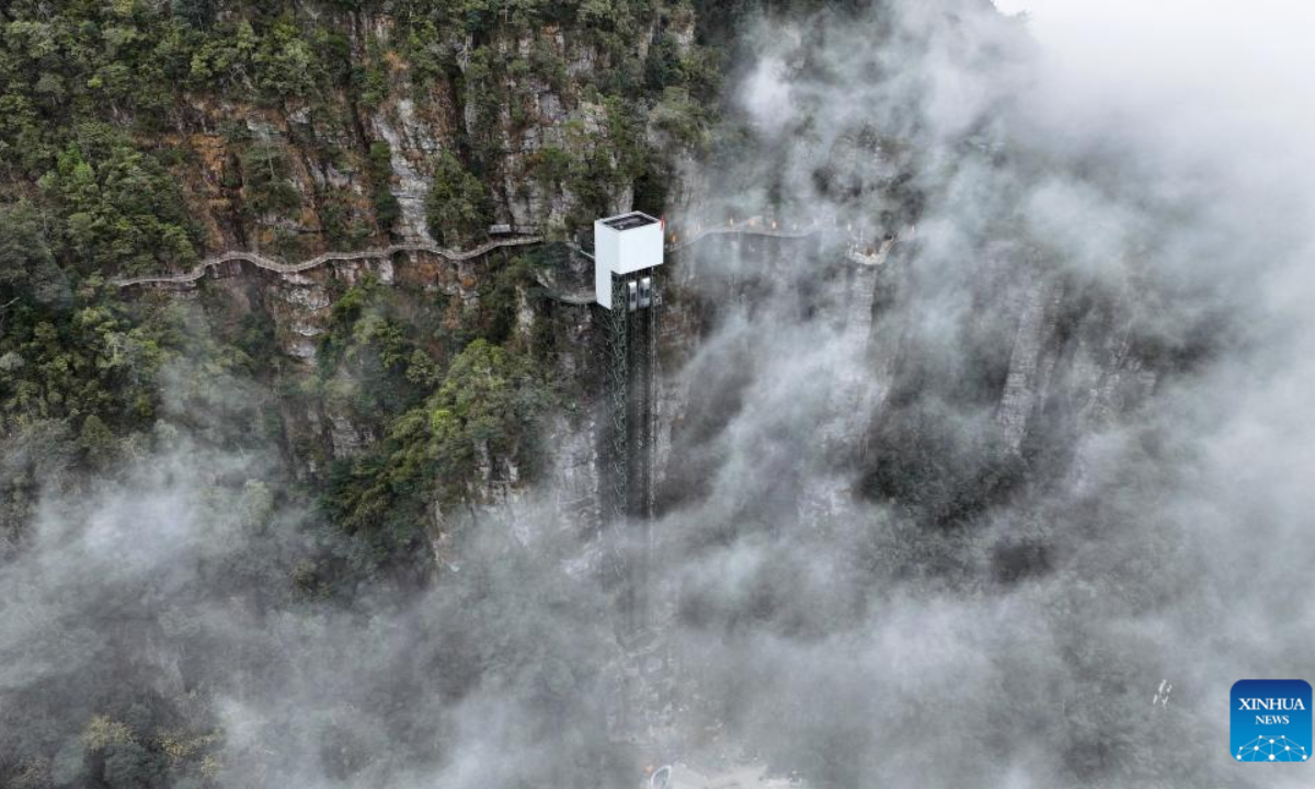 This undated file drone photo shows the twin elevators in Panwang Realm scenic spot in Dayao Mountains, south China's Guangxi Zhuang Autonomous Region. (Xinhua)