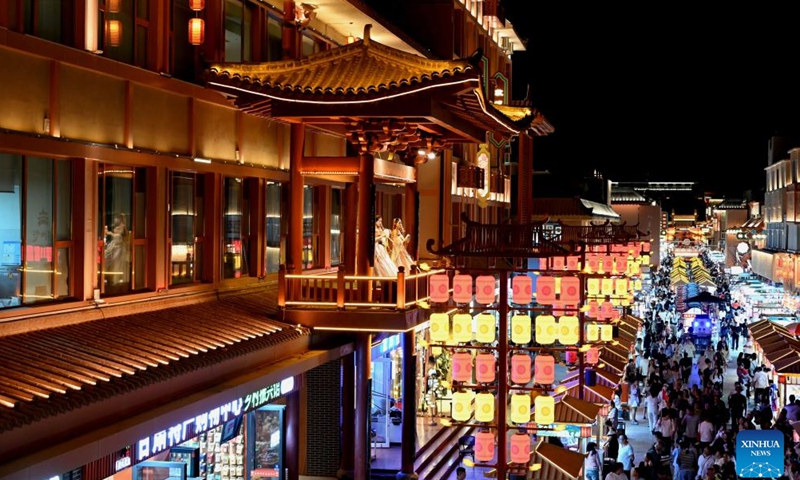 Tourists enjoy leisure time at a night market in Dunhuang City, northwest China's Gansu Province, May 31, 2025.