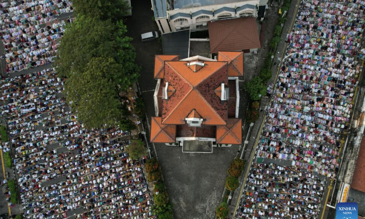 An aerial drone photo shows people performing Eid al-Adha prayer at Jatinegara in Jakarta, Indonesia on June 6, 2025. (Xinhua/Veri Sanovri)