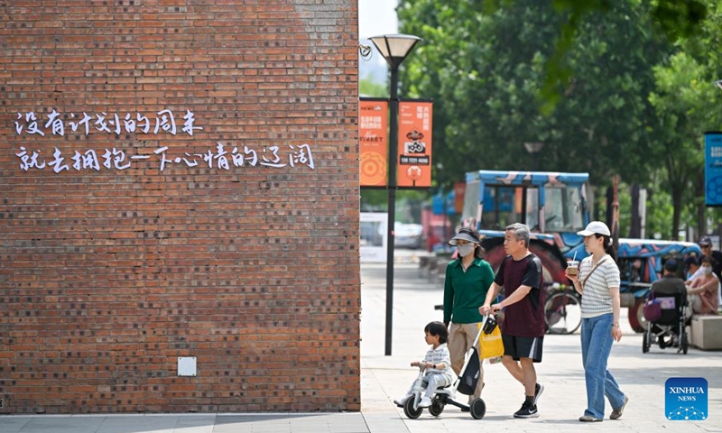 Citizens are seen in a renovated block at Tianjin Tractor Factory area in north China's Tianjin on May 30, 2025. 