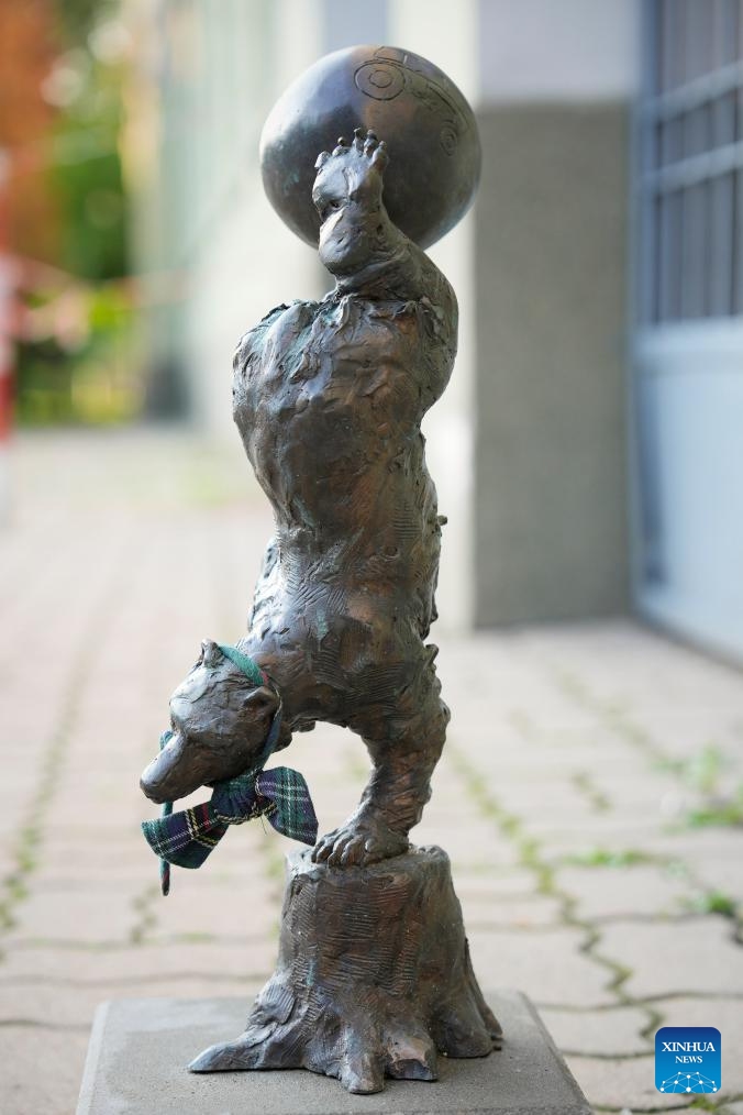 This photo taken on June 3, 2025, shows a sculpture of an acrobat bear near a sports complex in the Ursus district of Warsaw, Poland. Named after the Latin word for bear, Ursus also features a bear in its coat of arms. The district has installed several themed bear sculptures -- like a farmer, mechanic, and football player -- each suited to its location. (Photo by Jaap Arriens/Xinhua)