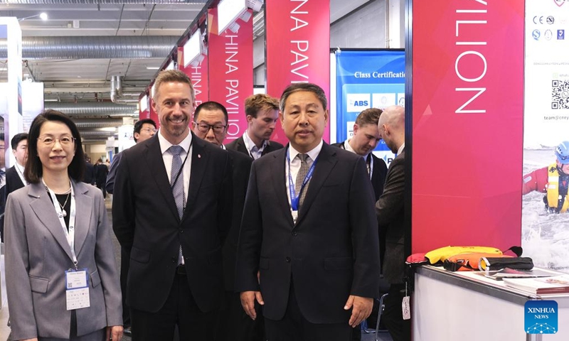 Even Tronstad Sagebakken (2nd L, Front), state secretary at Norway's Ministry of Trade, Industry and Fisheries, tours the China Pavilion at Nor-Shipping 2025 in Lillestrom, Norway, on June 3, 2025. A Norwegian official has praised the green technologies and innovative solutions showcased by Chinese companies at Nor-Shipping 2025, expressing hope for enhanced maritime cooperation between Norway and China. (Xinhua/Zhang Yuliang)