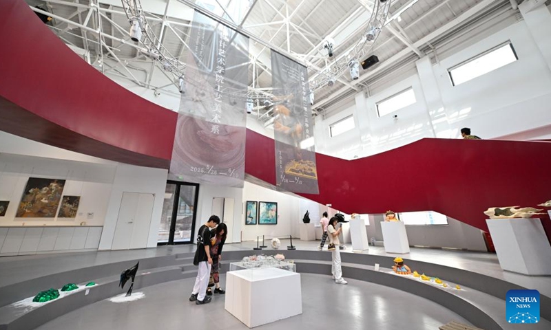 People visit a renovated exhibition area at Tianjin Academy of Fine Arts area in north China's Tianjin on June 2, 2025. (Xinhua/Sun Fanyue)