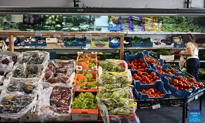 A woman shops at a supermarket in Brussels, Belgium, June 3, 2025. The Eurozone's annual inflation rate for May stood at 1.9 percent, down from 2.2 percent in April, bringing inflation back below the European Central Bank's (ECB) target of 2 percent, according to a flash estimate published Tuesday by Eurostat. (Photo by Gao Yi/Xinhua)