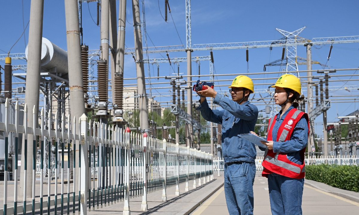 Employees from a local power supply company in Northwest China's Ningxia Hui Autonomous Region conduct special inspections on June 5, 2025 at a 220-kilovolt substation to ensure the normal operation of power supply equipment for the college entrance exams. The examination area in Yinchuan encompasses 14 centers, involving 14 critical substations and 56 essential power lines, as the local supplier enhances inspection amid the exam period. 
Photo: VCG