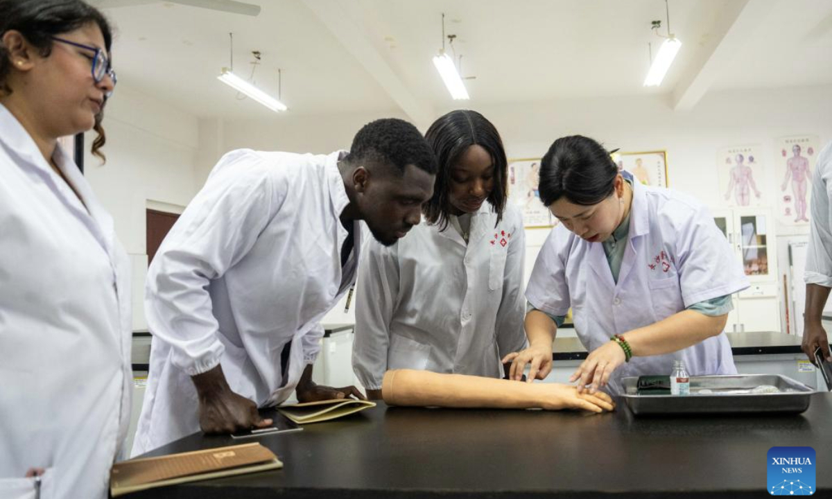 Teacher Ding Le (1st R) gives a class on acupuncture to international students at Changsha Medical University in Changsha, central China's Hunan Province, June 19, 2025.
The international exchanges division of Changsha Medical University was established in 2006. Currently, more than 20 international students from 13 African countries are pursuing further studies at the institution.
The school promotes cultural exchange globally while popularizing traditional Chinese medicine through courses including surgery, medicine, acupuncture, and tuina (therapeutic massage). (Xinhua/Chen Sihan)