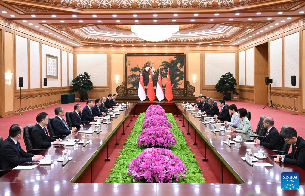 Chinese President Xi Jinping meets with Singaporean Prime Minister Lawrence Wong, who is on an official visit to China, at the Great Hall of the People in Beijing, capital of China, June 24, 2025. (Xinhua/Xie Huanchi)