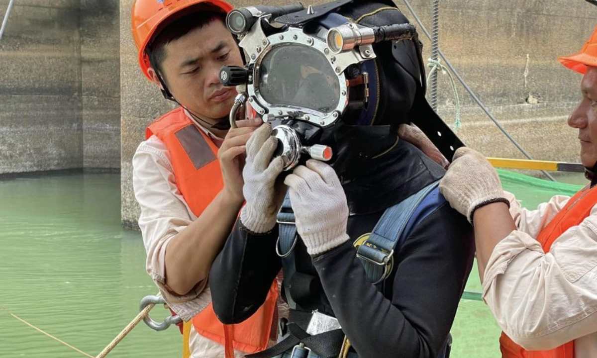 This photo taken on March 25, 2024 shows a worker preparing to dive for the rehabilitation work at the Kainji Hydropower Plant in Niger State, Nigeria. (PowerChina Huadong Engineering Corporation Limited/Handout via Xinhua)