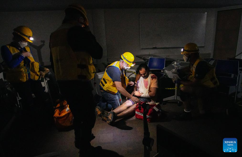 Members of a search and rescue team rescue a victim in a mock earthquake scenario during an emergency response exercise in Burnaby, British Columbia, Canada, on June 11, 2025. As one of the city's largest emergency response exercises, the event involved simulated earthquake-related injuries and hazards for participants to enhance response skills and strengthen coordination. (Photo by Liang Sen/Xinhua)