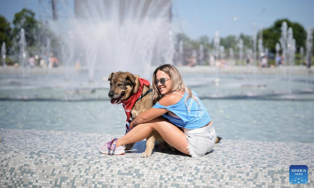 A resident with a dog participates in the Warsaw Pets Day held in Warsaw, Poland on June 15, 2025. (Photo by Jaap Arriens/Xinhua)