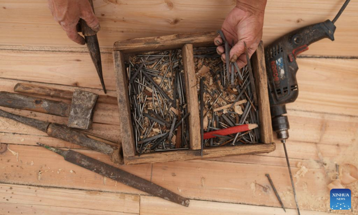 This photo taken on June 12, 2025 shows a toolbox of Qian Shoutang in Shaoxing, east China's Zhejiang Province. The black-awning boat is unique transportation means in Shaoxing with a long history. The making technique of the black-awning boat was inscribed on the list of provincial intangible cultural heritage of Zhejiang in 2009. Qian Shoutang, 68, is a representative inheritor of the technique in Shaoxing. Born in a family with a black-awning boat making tradition, Qian has engaged himself in making boats for over half a century. Currently, Qian and his apprentices make more than ten black-awning boats each year, primarily for use in scenic areas. As more and more people, especially young generation, are fascinated with traditional culture, it is meaningful for me to pass down the technique, said Qian. (Xinhua/Weng Xinyang)