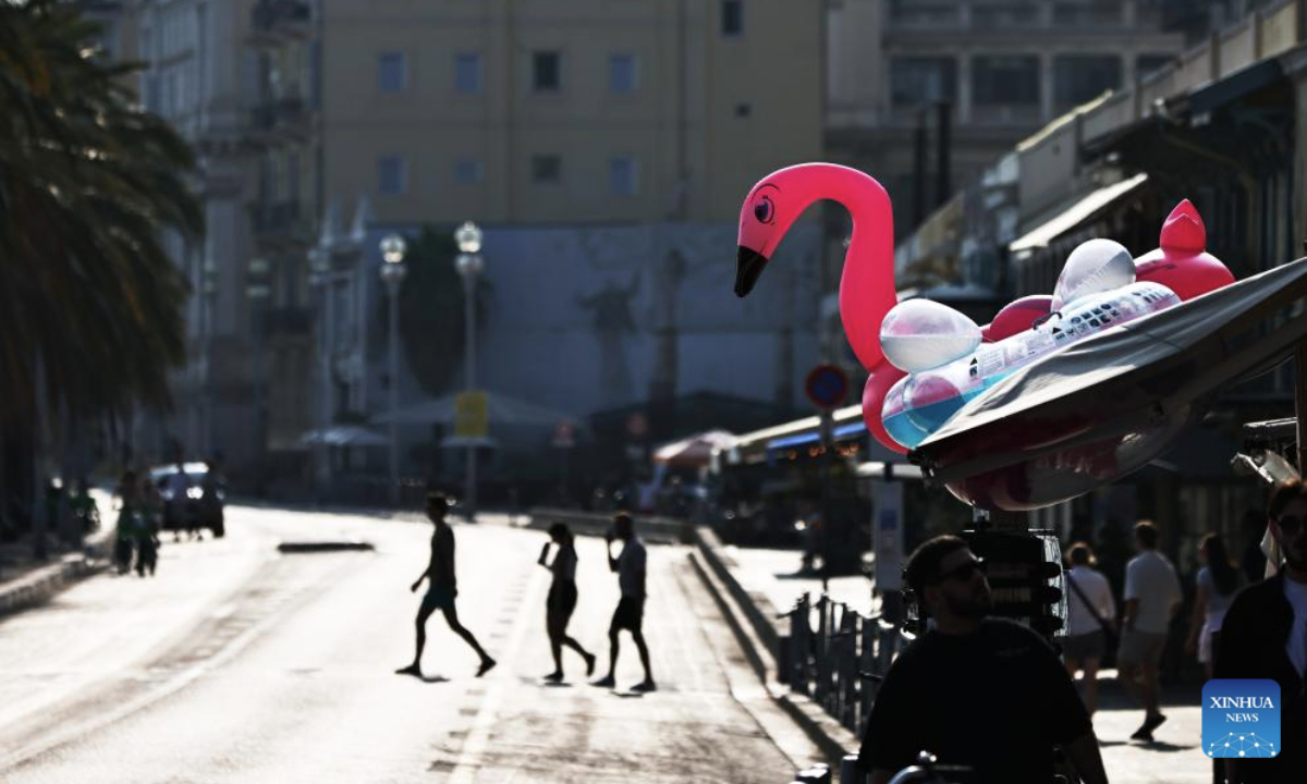 People walk on a street in Nice, France, June 10, 2025. The UNOC3 opened on Monday in Nice, a coastal city in southern France, under the theme of Accelerating action and mobilizing all actors to conserve and sustainably use the ocean. (Xinhua/Gao Jing)