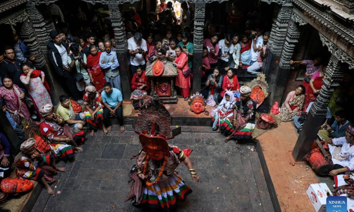 People watch a traditional Navadurga dance performance in Bhaktapur, Nepal, June 18, 2025. Navadurga means nine forms of goddess Durga. (Photo by Sulav Shrestha/Xinhua)