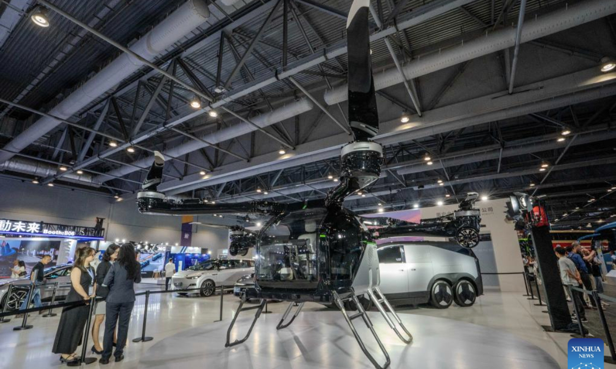 People visit the 2025 International Automotive & Supply Chain Expo (Hong Kong) in Hong Kong, south China, June 12, 2025. The 2025 International Automotive & Supply Chain Expo (Hong Kong) opened here on Thursday. (Xinhua/Lui Siu Wai)