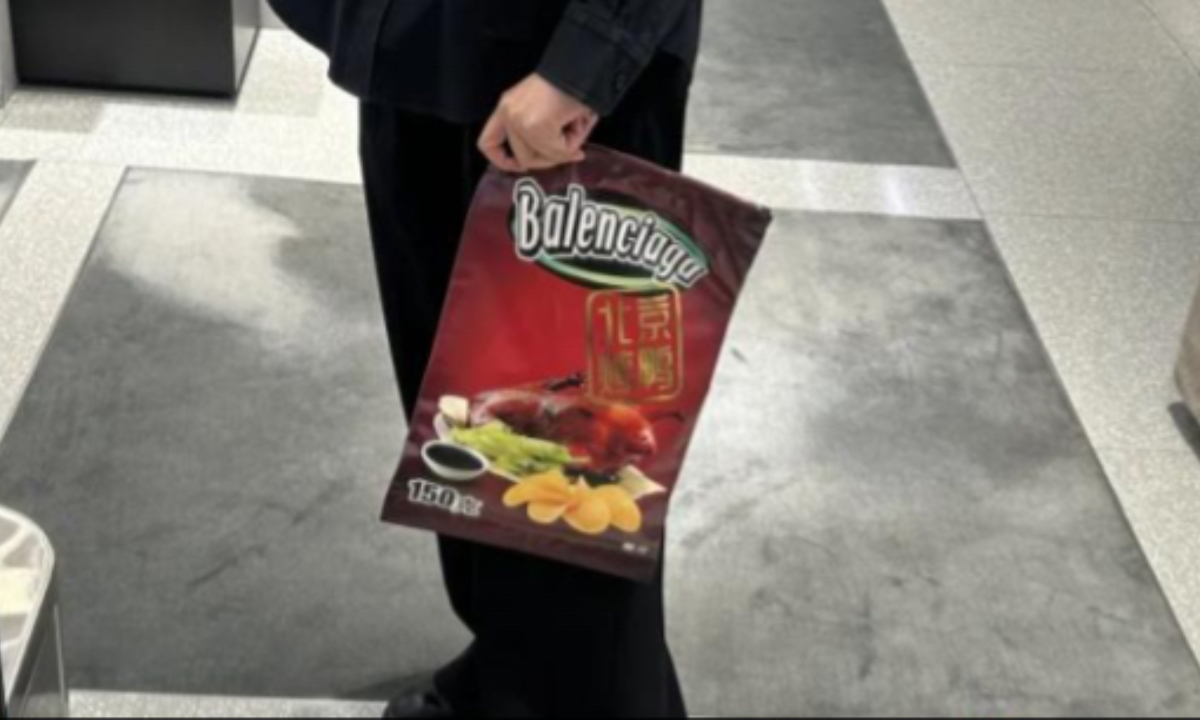 A Balenciaga clutch bag printed with images of Beijing roast duck and Chinese characters. Photo: Screenshot from media report