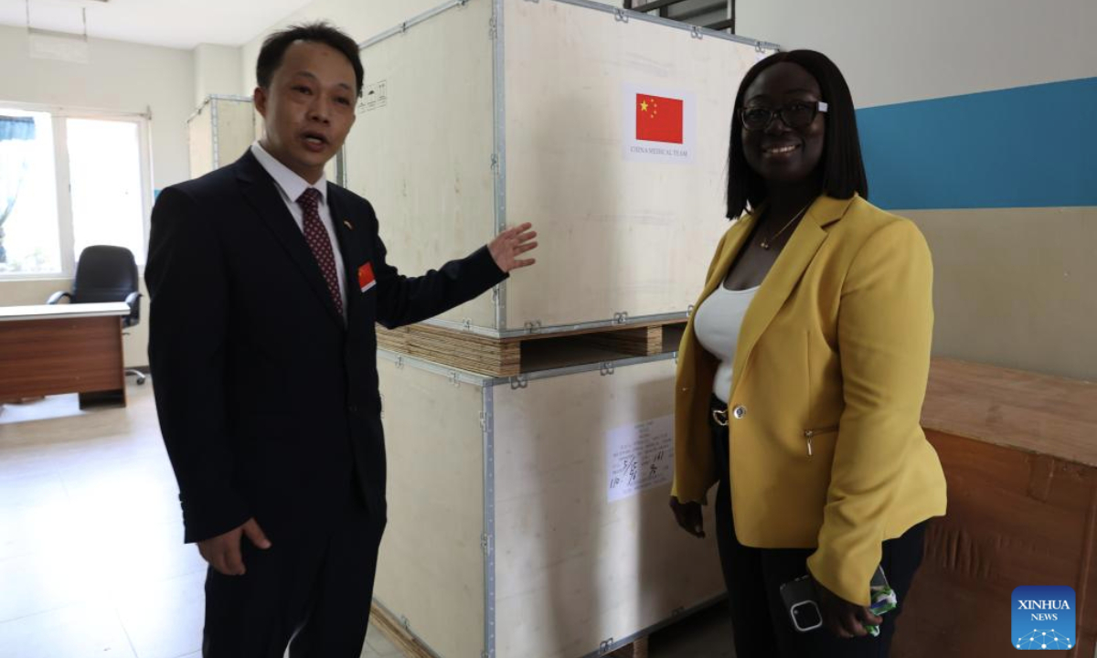 Yang Yongguang (L), head of the 14th Chinese medical team to Ghana, introduces medical supplies to a representative of Lekma Hospital in Accra, Ghana, on June 16, 2025. (Photo by Seth/Xinhua)

