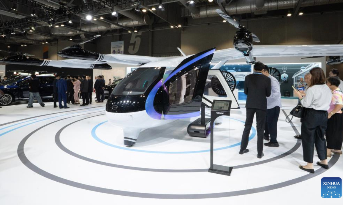 People visit the 2025 International Automotive & Supply Chain Expo (Hong Kong) in Hong Kong, south China, June 12, 2025. The 2025 International Automotive & Supply Chain Expo (Hong Kong) opened here on Thursday. (Xinhua/Lui Siu Wai)