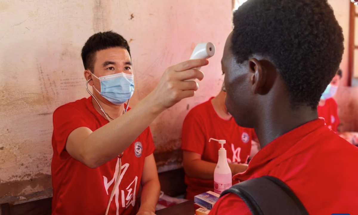 Chinese doctor Chen Qiuyu measures body temperature for a local student at the Samora Moises Machel High School in Bissau, capital of Guinea-Bissau, June 13, 2025.

(The 20th batch of Chinese medical team in Guinea-Bissau/Handout via Xinhua)