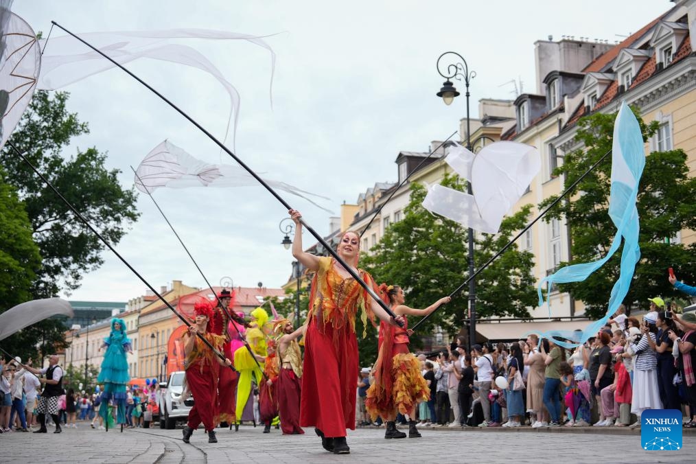 Performers wave long streamers during the Mermaid Parade in Warsaw, Poland, June 7, 2025. The parade, featuring 20 floats, was held in the Polish capital on Saturday to honor the Warsaw Mermaid, an iconic symbol of the city. (Photo: Xinhua)