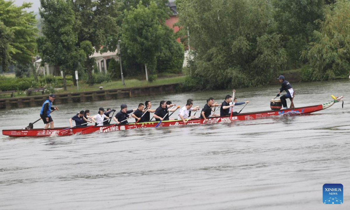 People take part in a dragon boat match in Remich, Luxembourg, June 15, 2025. (Xinhua/Zhao Dingzhe)