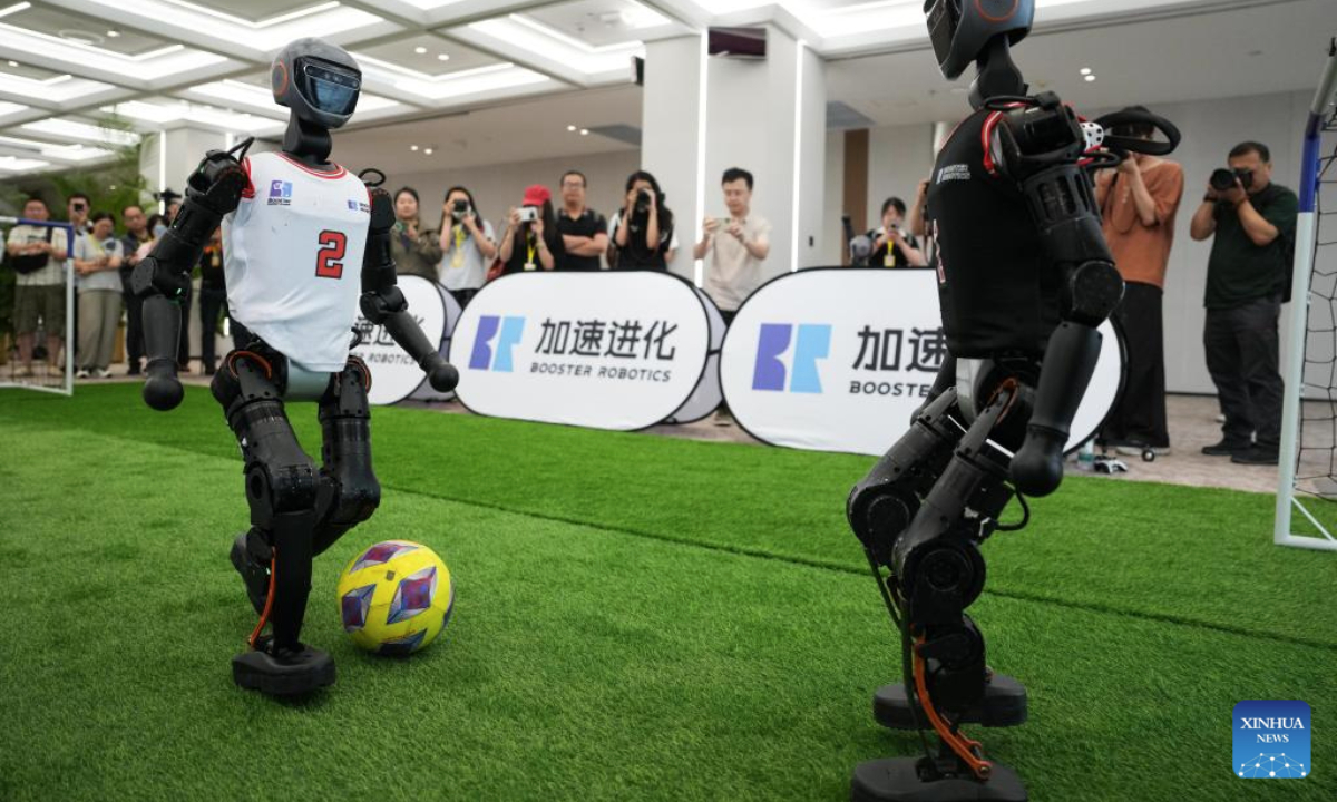 Booster T1 humanoid robots play football in the Beijing Economic-Technological Development Area in Beijing, capital of China, on June 17, 2025.

In recent years, Beijing has leveraged its technological and industrial innovation advantages to build a high-end industrial cluster of robots. At present, the Beijing Economic-Technological Development Area has gathered over 300 robot related enterprises. (Xinhua/Zheng Huansong)