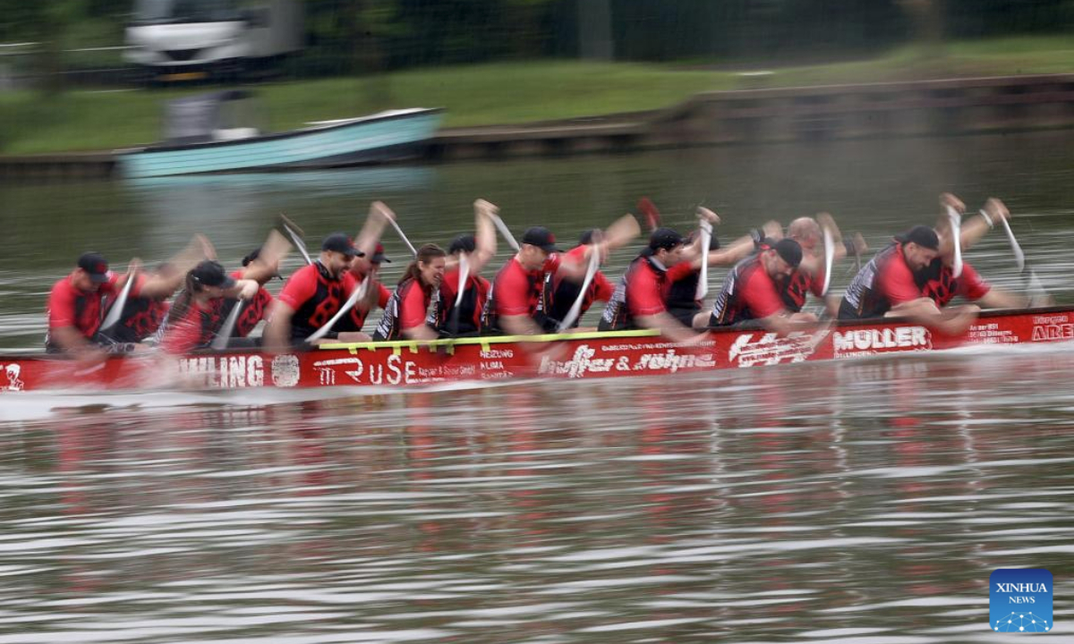 People take part in a dragon boat match in Remich, Luxembourg, June 15, 2025. (Xinhua/Zhao Dingzhe)