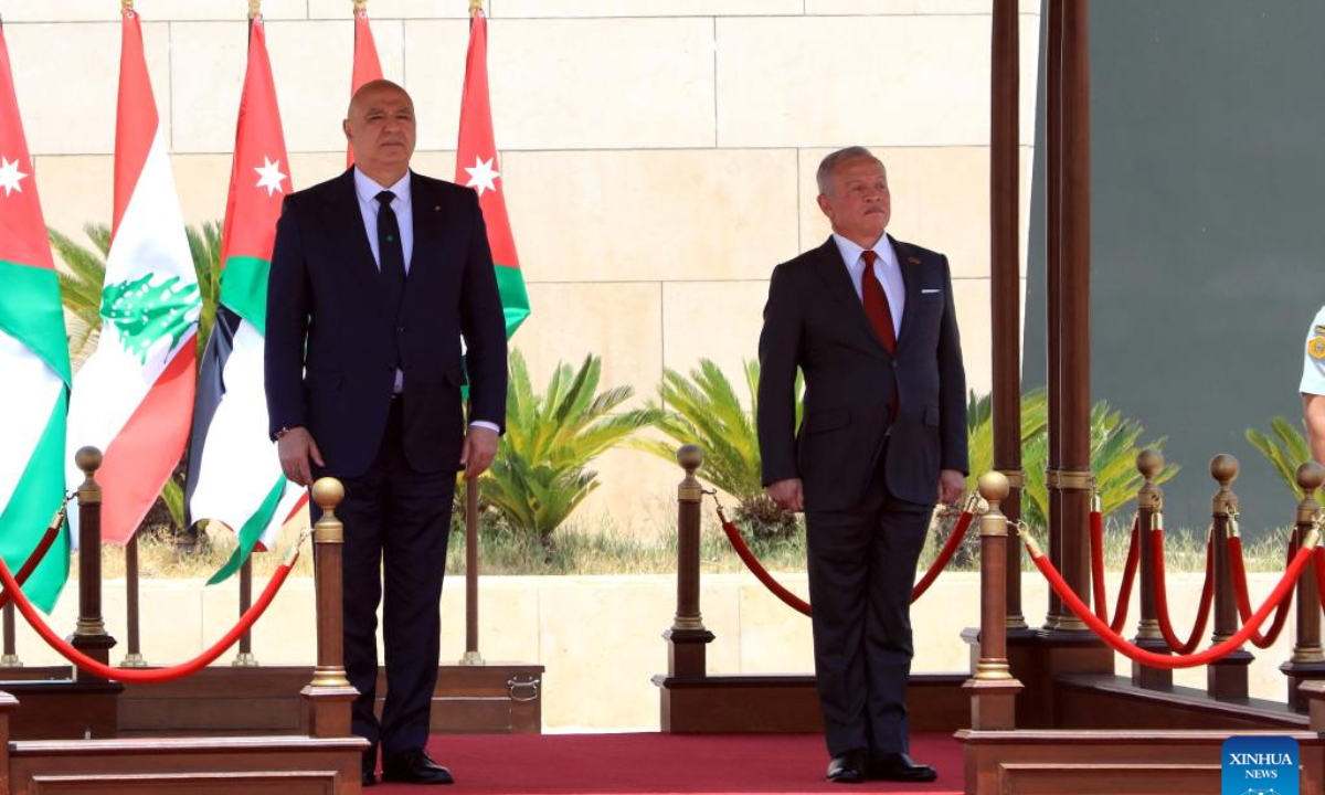King Abdullah II of Jordan (R) welcomes Lebanese President Joseph Aoun at Marka Military Airport in Amman, Jordan, on June 10, 2025. King Abdullah II of Jordan met with visiting Lebanese President Joseph Aoun here on Tuesday to explore ways to deepen bilateral relations and address pressing regional developments, according to a statement released by the Royal Hashemite Court. (Photo by Mohammad Abu Ghosh/Xinhua)