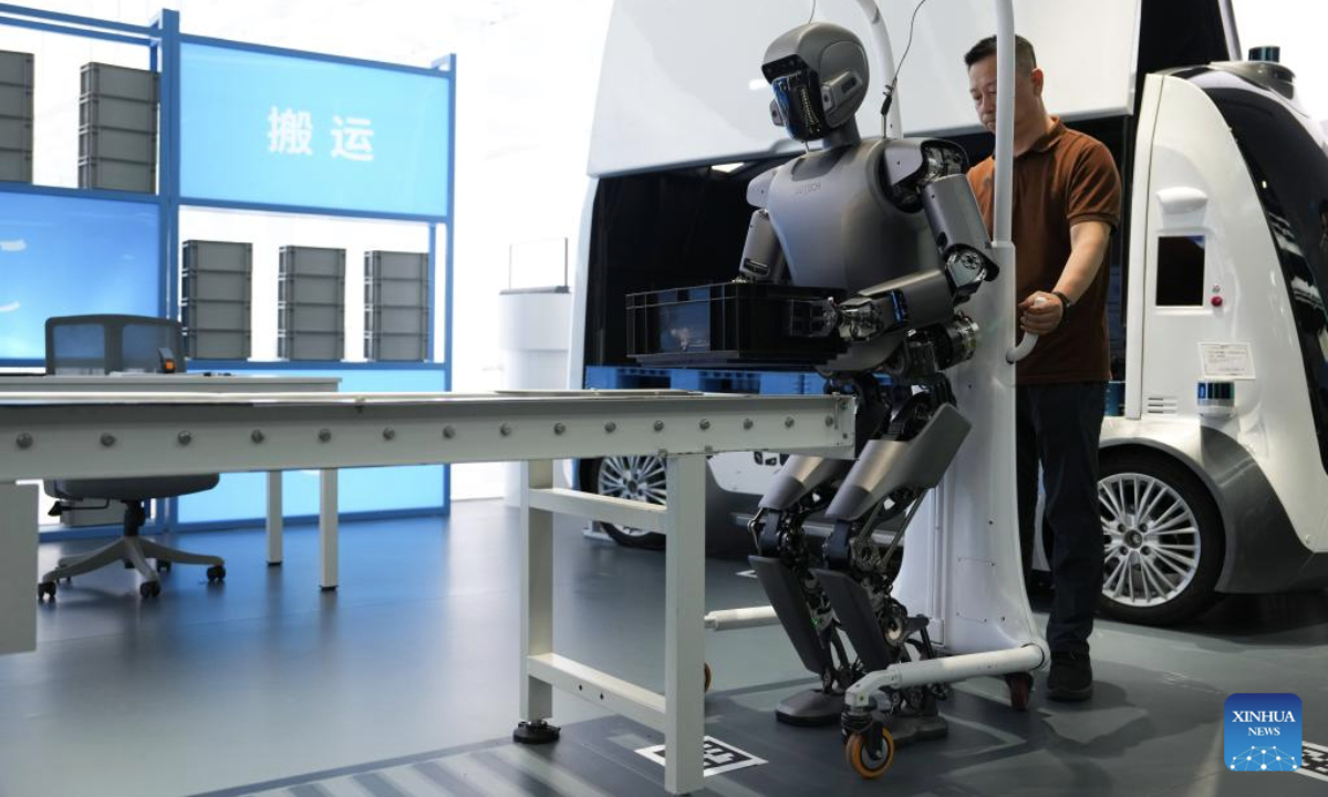 A Walker S1 humanoid robot transfers a box in Beijing Economic-Technological Development Area in Beijing, capital of China, on June 17, 2025.

In recent years, Beijing has leveraged its technological and industrial innovation advantages to build a high-end industrial cluster of robots. At present, the Beijing Economic-Technological Development Area has gathered over 300 robot related enterprises. (Xinhua/Zheng Huansong)