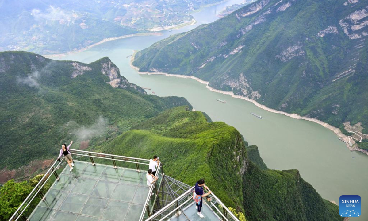 People visit Qutang Gorge, one of the Three Gorges on the Yangtze River, in Fengjie County, southwest China's Chongqing Municipality, June 9, 2025. (Xinhua/Wang Quanchao)