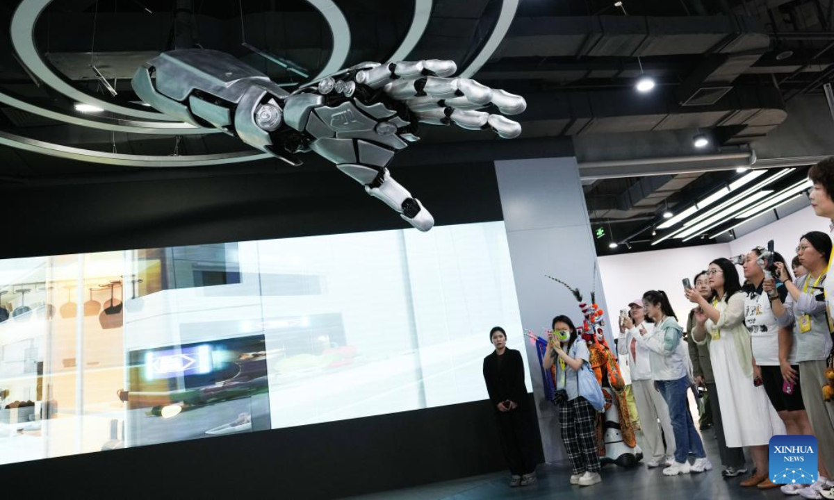 Journalists visit a robot center in Beijing Economic-Technological Development Area in Beijing, capital of China, on June 17, 2025.

In recent years, Beijing has leveraged its technological and industrial innovation advantages to build a high-end industrial cluster of robots. At present, the Beijing Economic-Technological Development Area has gathered over 300 robot related enterprises. (Xinhua/Zheng Huansong)