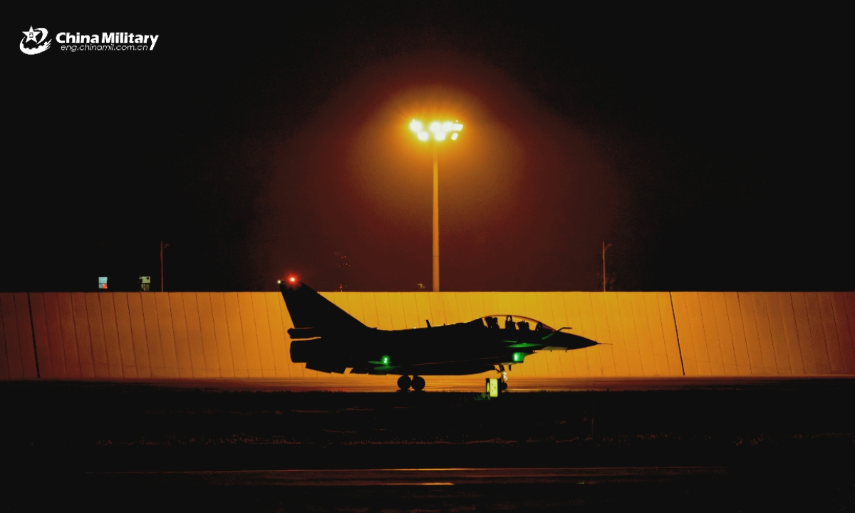 A J-10 fighter jet attached to an aviation brigade with the air force under the Chinese PLA Southern Theater Command taxis on the runway during a nighttime flight training exercise in recent days. (eng.chinamil.com.cn/Photo by Xiao Rui)