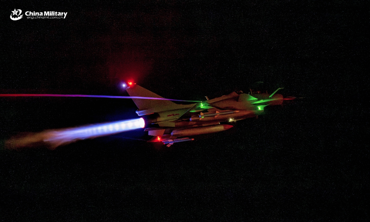 A J-10 fighter jet attached to an aviation brigade with the air force under the Chinese PLA Southern Theater Command takes off during a nighttime flight training exercise in recent days. (eng.chinamil.com.cn/Photo by Xiao Rui)