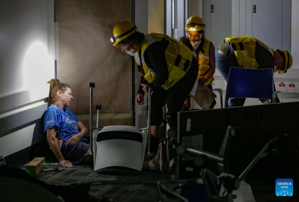Members of a search and rescue team rescue a victim in a mock earthquake scenario during an emergency response exercise in Burnaby, British Columbia, Canada, on June 11, 2025. As one of the city's largest emergency response exercises, the event involved simulated earthquake-related injuries and hazards for participants to enhance response skills and strengthen coordination. (Photo by Liang Sen/Xinhua)