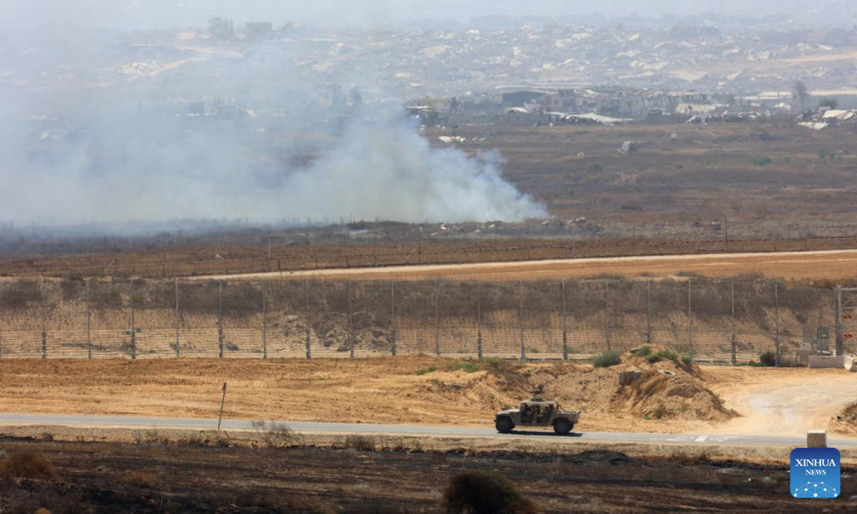 Smoke billows following Israeli strikes in the Gaza Strip, as seen from Israel's southern border with the Gaza Strip, on June 12, 2025. According to the Gaza-based health authorities on Thursday, at least 55,207 Palestinians have been killed, the majority of whom are reported to be women and children. (Photo by Gil Cohen Magen/Xinhua)