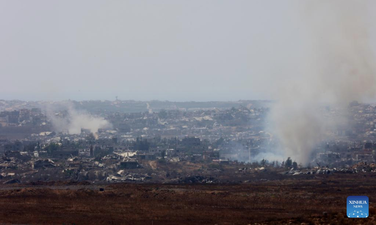 Smoke billows following Israeli strikes in the Gaza Strip, as seen from Israel's southern border with the Gaza Strip, on June 12, 2025. According to the Gaza-based health authorities on Thursday, at least 55,207 Palestinians have been killed, the majority of whom are reported to be women and children. (Photo by Gil Cohen Magen/Xinhua)