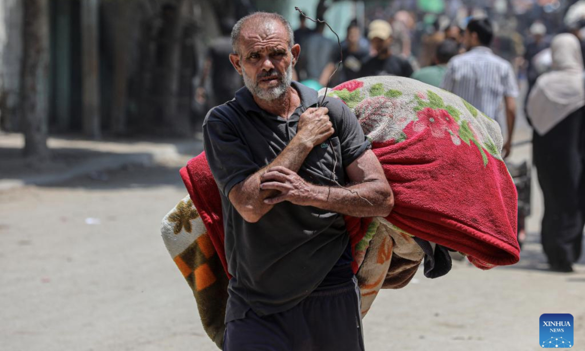 A Palestinian evacuated from Jabalia in northern Gaza Strip arrives in Gaza City, on June 9, 2025. The Israel Defense Forces (IDF) on Saturday issued an evacuation warning for residents in two areas of the northern Gaza Strip ahead of strikes. The warning applies to the Abd al-Rahman neighborhood in the northwest of Gaza City and the Nahda neighborhood in the Jabalia refugee camp, IDF spokesperson Avichay Adraee announced on social media platform X. (Photo by Rizek Abdeljawad/Xinhua)