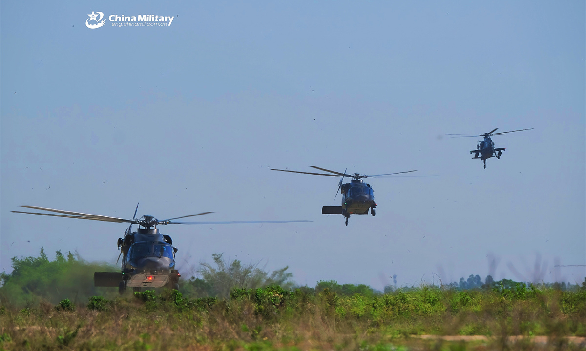 A group of helicopters attached to an army aviation brigade under the Chinese PLA 75th Group Army lift off successively for a flight training exercise in late May, 2025. (eng.chinamil.com.cn/Photo by Cao Yiqing)