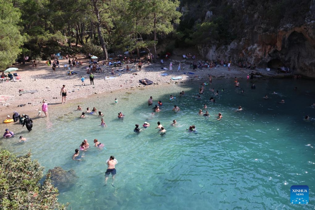 People enjoy leisure time on a beach in Antalya, Türkiye, on June 7, 2025. (Photo: Xinhua)