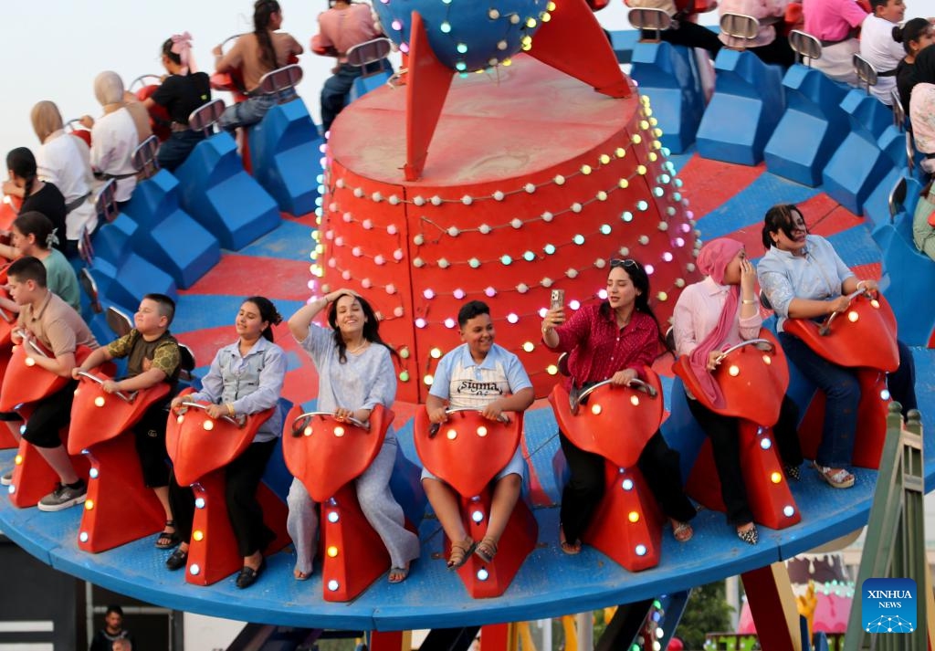 People play at an amusement park during Eid al-Adha in Baghdad, Iraq, on June 7, 2025. (Photo: Xinhua)