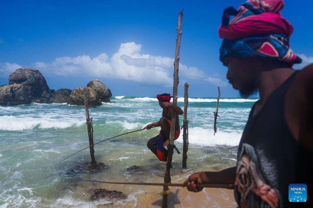 Stilt fishermen are seen near the southern Sri Lankan city of Galle, June 5, 2025. (Photo: Xinhua)