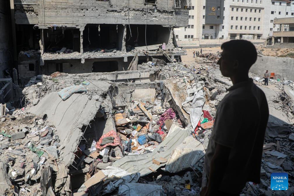 A Palestinian looks at buildings destroyed in an Israeli airstrike in Gaza City, June 7, 2025. (Photo: Xinhua)