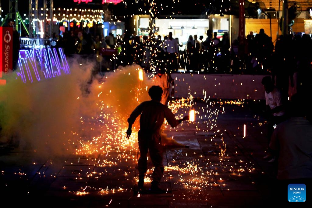 People watch a firework show at an amusement park during Eid al-Adha in Baghdad, Iraq, on June 7, 2025. (Photo: Xinhua)
