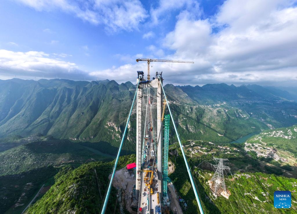 An aerial drone photo shows the construction site of the Huajiang Grand Canyon Bridge in southwest China's Guizhou Province, June 5, 2025. As workers started to remove the gantry cranes and install elevators, the construction of the Huajiang Grand Canyon Bridge, which is set to become the world's tallest bridge, is expected to complete in the second half of 2025. A project of Guizhou Transportation Investment Group Co., Ltd., the suspension bridge has a vertical height of 625 meters from the bridge deck down to the river surface. (Photo: Xinhua)