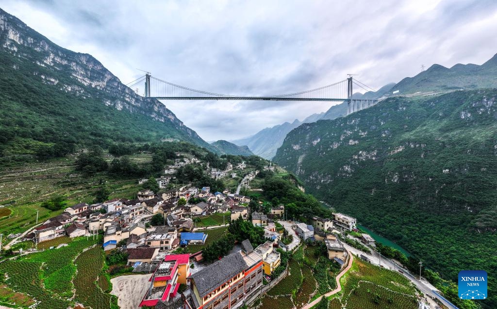 An aerial drone photo shows the Huajiang Grand Canyon Bridge seen from Huajiang Village in Pingjie Township of Zhenfeng County, southwest China's Guizhou Province, June 6, 2025. As workers started to remove the gantry cranes and install elevators, the construction of the Huajiang Grand Canyon Bridge, which is set to become the world's tallest bridge, is expected to complete in the second half of 2025. (Photo: Xinhua)