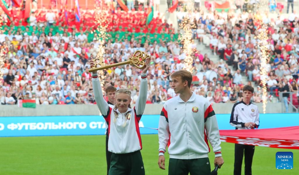 Representatives of Belarusian athletes demonstrate the key, a symbol of the Belarusian National Football Stadium project built with Chinese support, in Minsk, Belarus, June 7, 2025. The Belarusian National Football Stadium officially opened here on Saturday evening, with President Alexander Lukashenko attending the inauguration ceremony. (Photo: Xinhua)